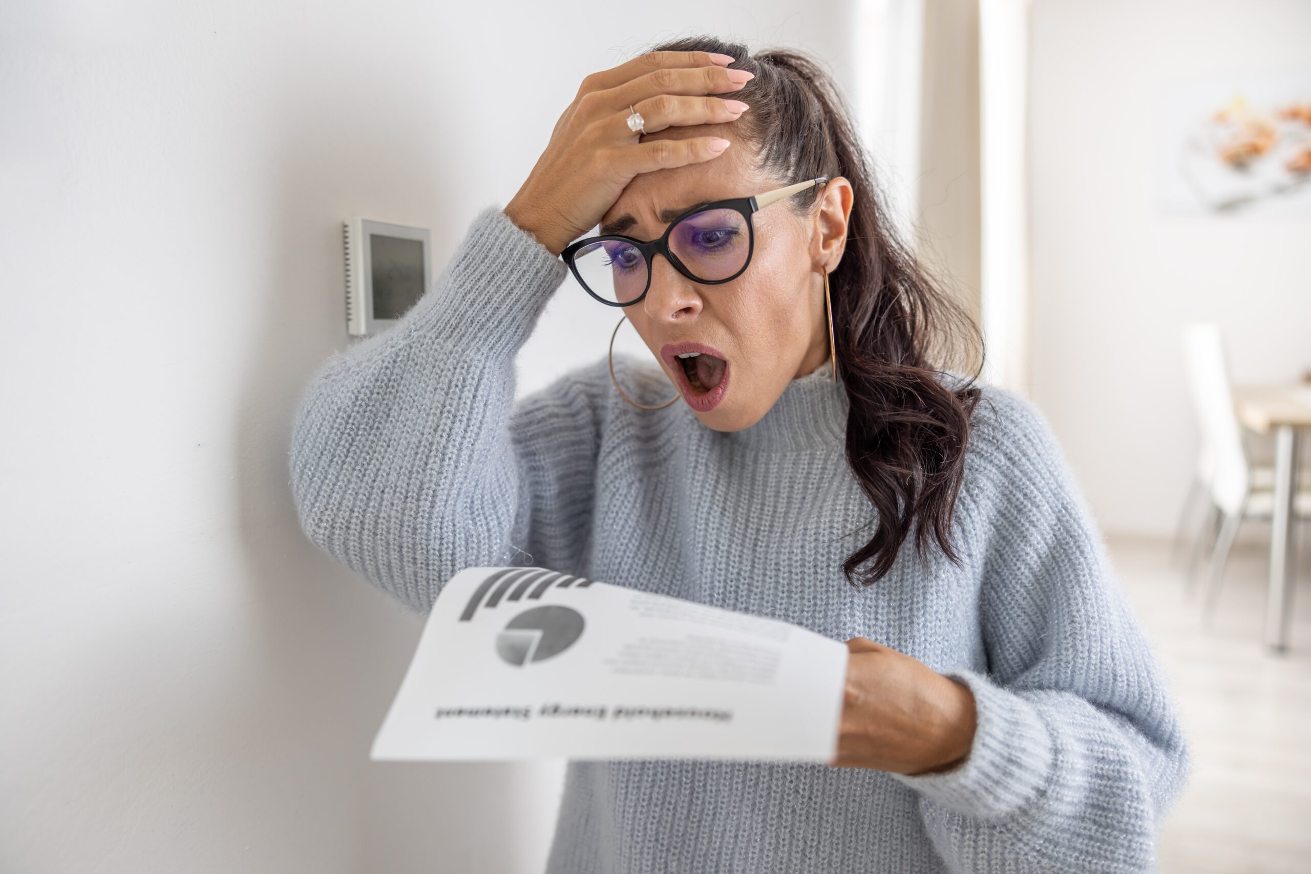 Woman,Is,Shocked,From,The,Rising,Energy,Costs,And,The energy bill